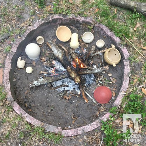 Fire pit with pots arranged around