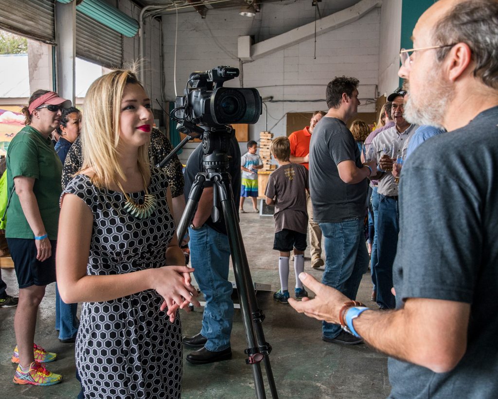 people speaking during the Miami blue butterfly beer event