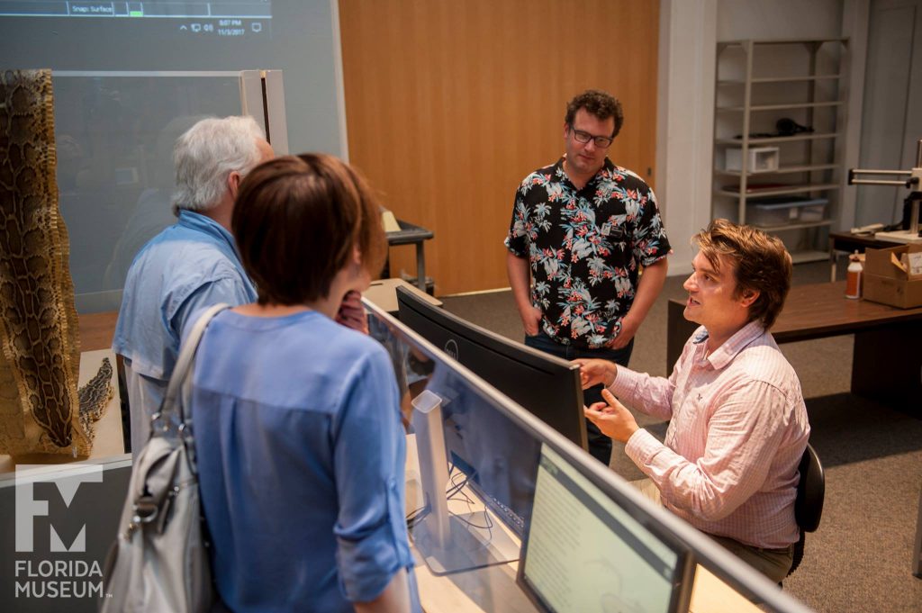 scientists talking with guests