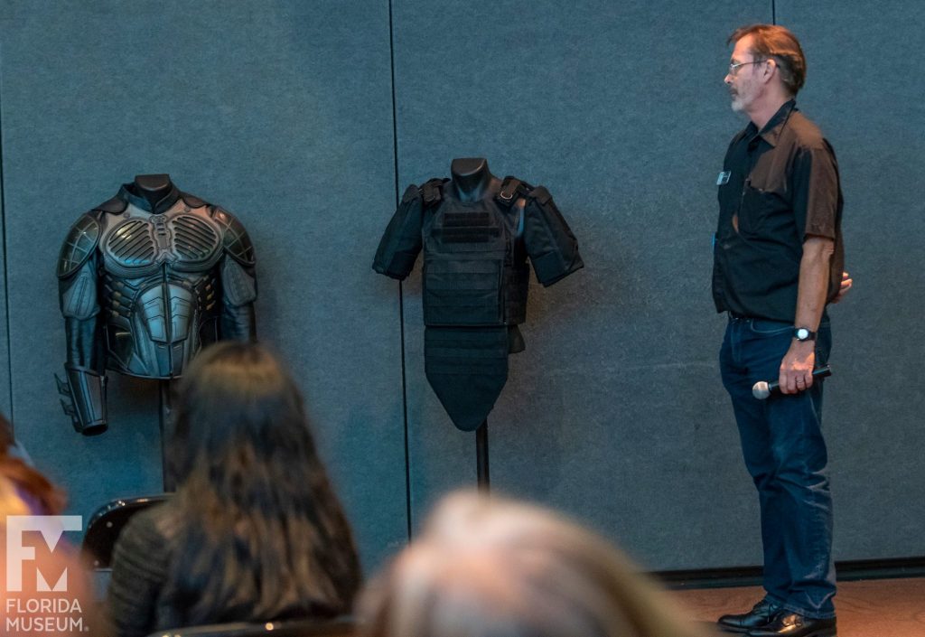 looking at body armor on display