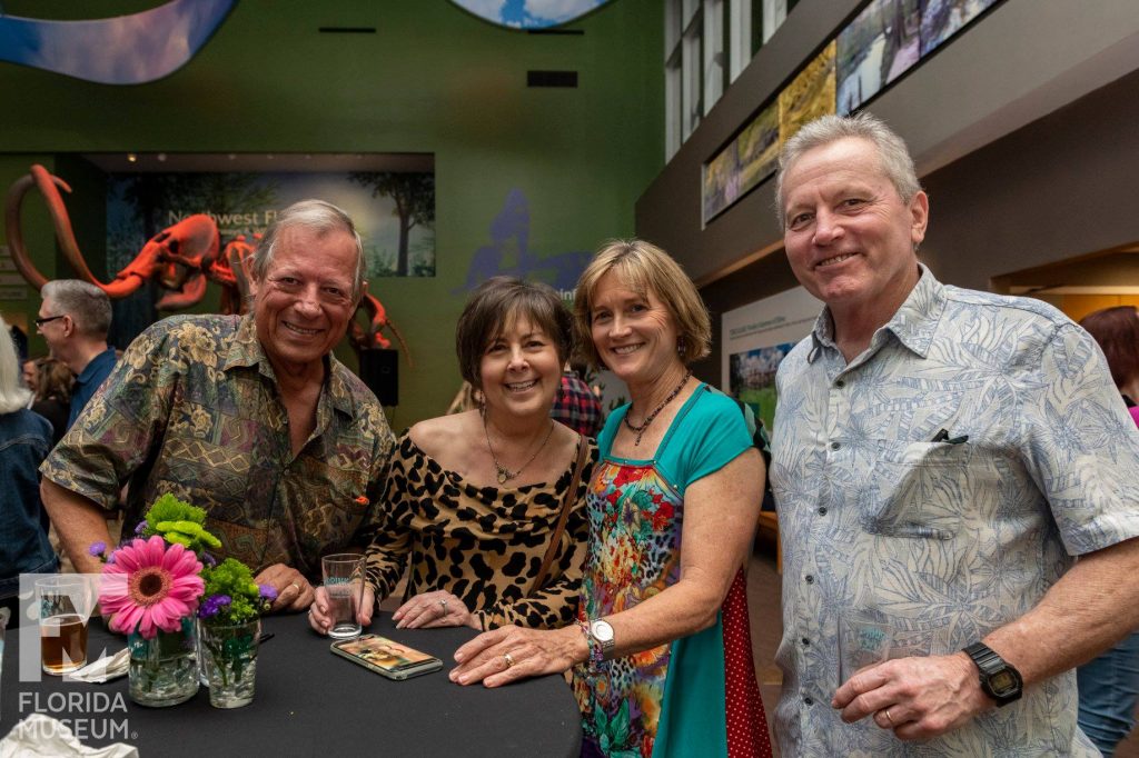 two couples smiling