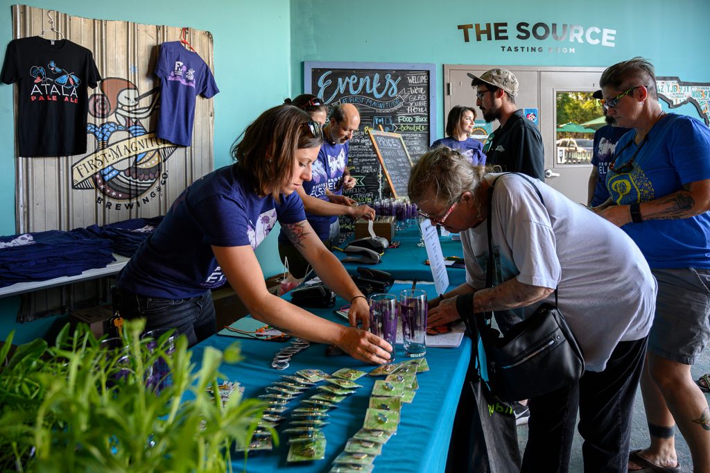 people purchase merchandise during the Frosted Elfin beer launch