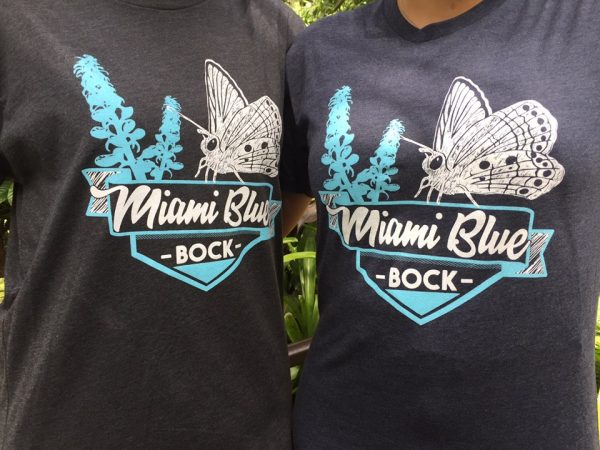 two people wearing Miami Blue Bock t-shirts