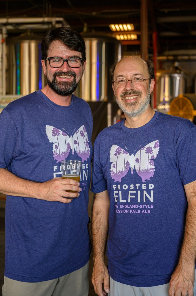 two people wearing the Frosted Elfin t-shirts