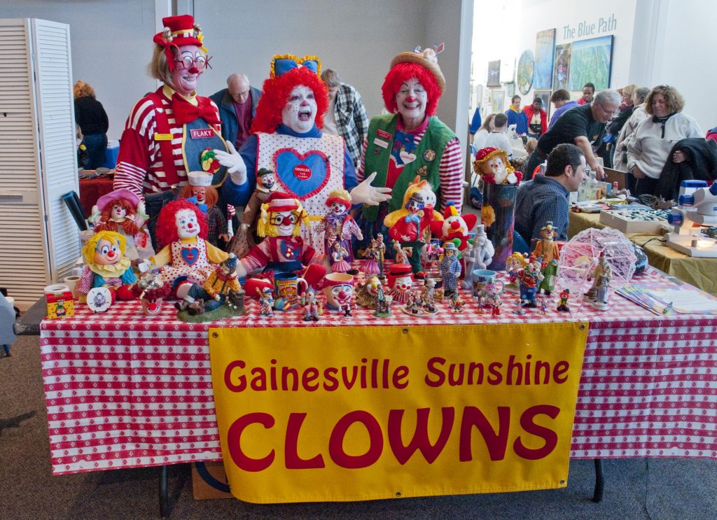 Clowns and clown items on a table.
