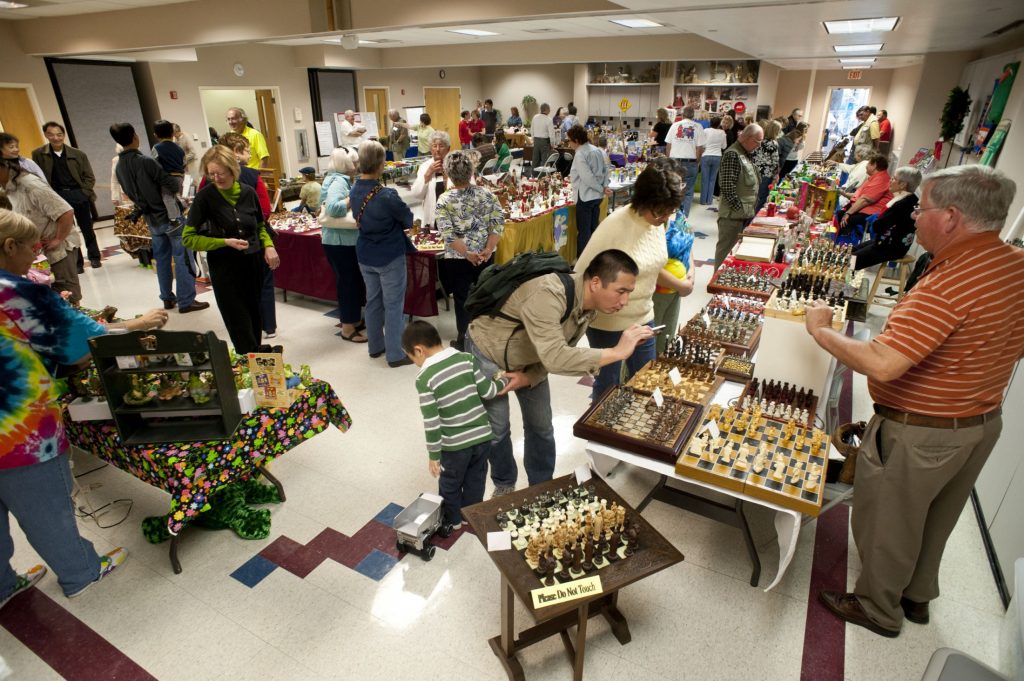 A photo of collectors and collections in a classroom.