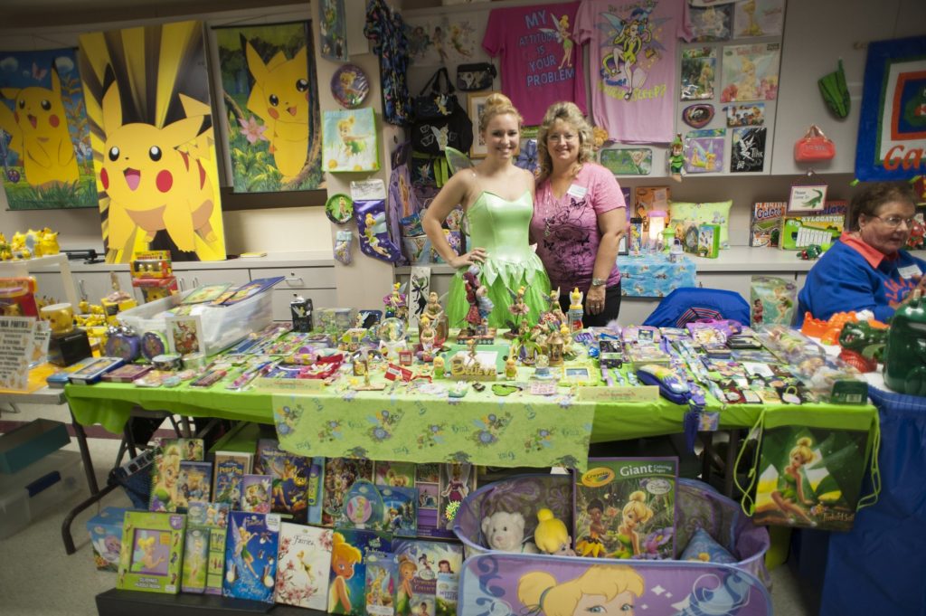 Two women with Tinkerbell-themed items