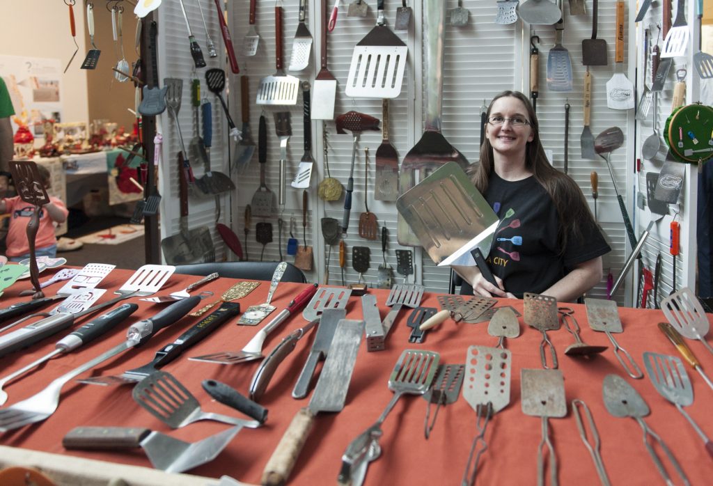 A woman pictured with her spatula collection