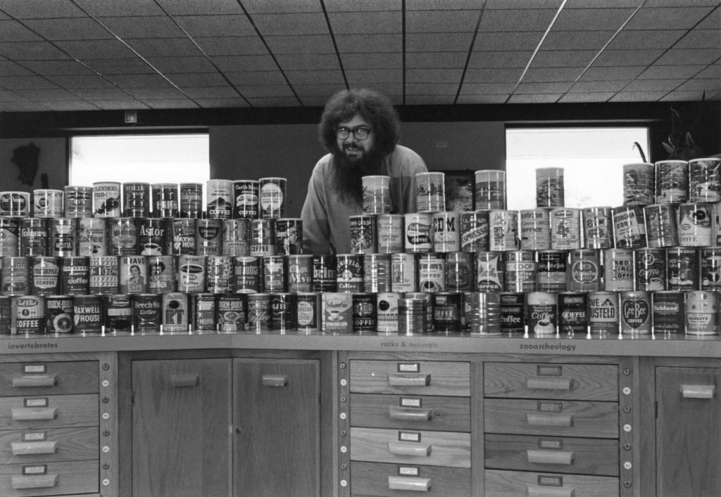 Thomas Olmstead with his coffee can collection.
