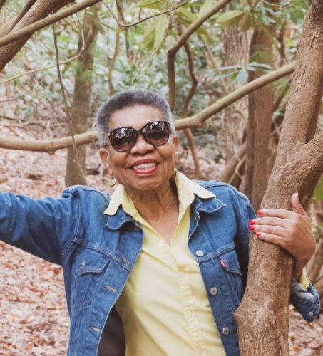 woman smiling by tree