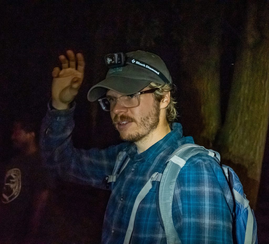 person wearing a headlamp flashlight