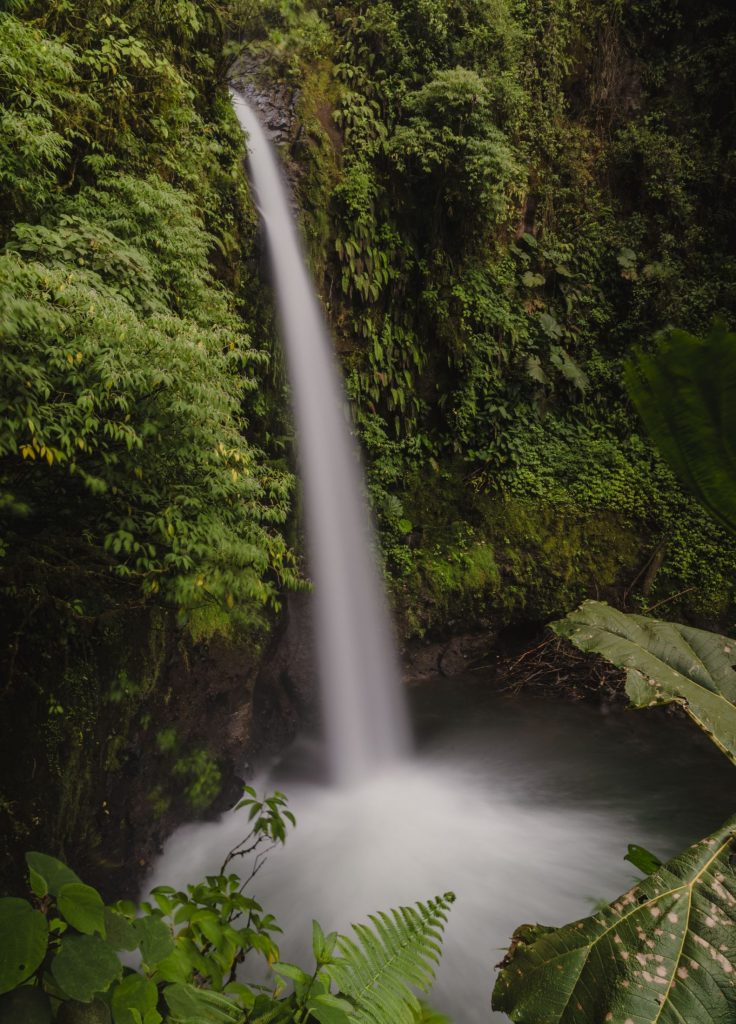 A scenic photograph of a waterfall in Costa Rica.