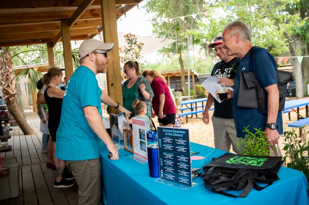 The Museum education team speaking with people at Pollinator Palooza