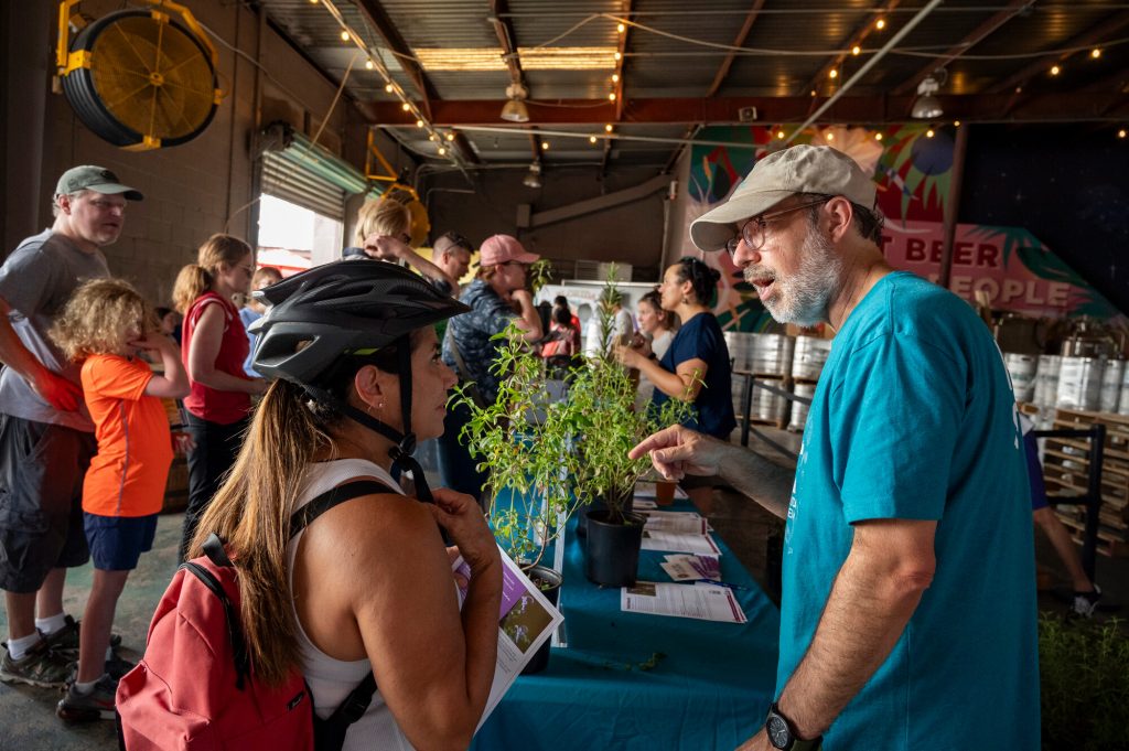 Jaret Daniels speaking Pollinator Palooza visitor