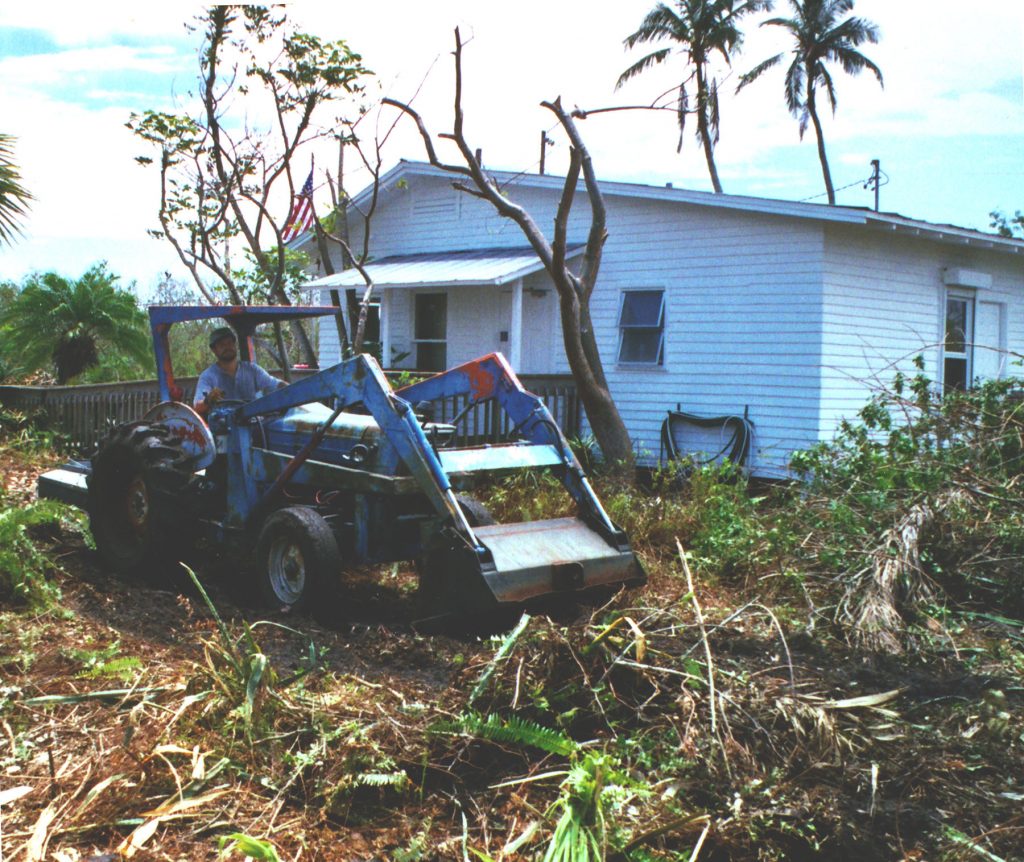 person on a tractor moved hurricane debris