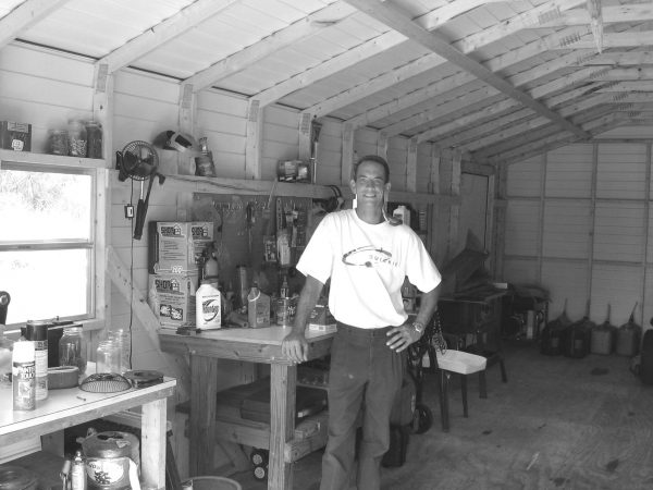 photo of a man standing in a storage shed