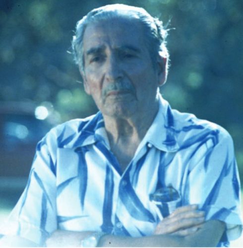 photo of a man standing with his arms crossed