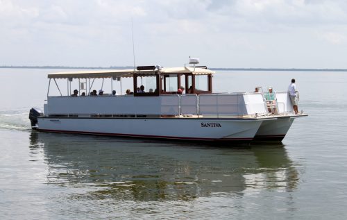 long boat with big deck for tour groups