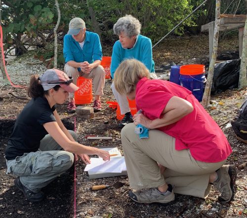 FPAN archaeologist Rachael Kangas looks over excavation plans.