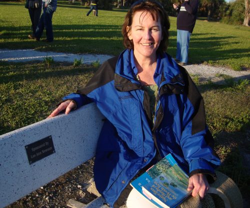 woman sitting on park bench