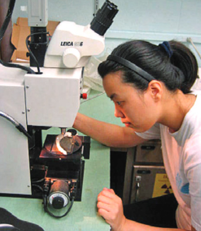 woman looking through a micro-mill