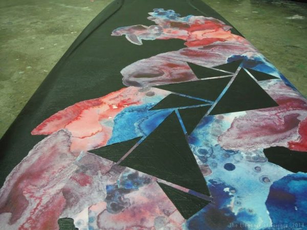 longboard painted with geometric patterns