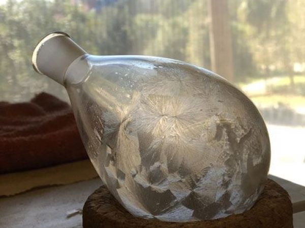bottle with substance crystallized inside