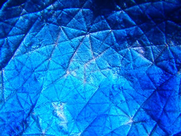 Beauty is Skin-Deep by Kristen Solocinski: This is an image of skin magnified under a home-made microscope. Using a YouTube tutorial, a laser pointer lens and some wood and screws, I made a microscope I can use with my phone. After a sun burn (use sunscreen!) I added a bit of food coloring to some peeled skin and got an image more beautiful than you would probably expect from shed skin. Perspective can greatly change perception.