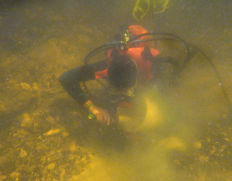 Figure 1. Former UF grad student Alex Hastings collecting in situ fossiliferous sediment at the Withlacoochee River 1A site in 2009.