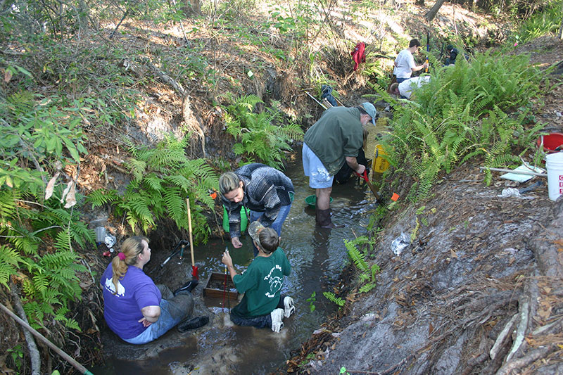 People in creek bed