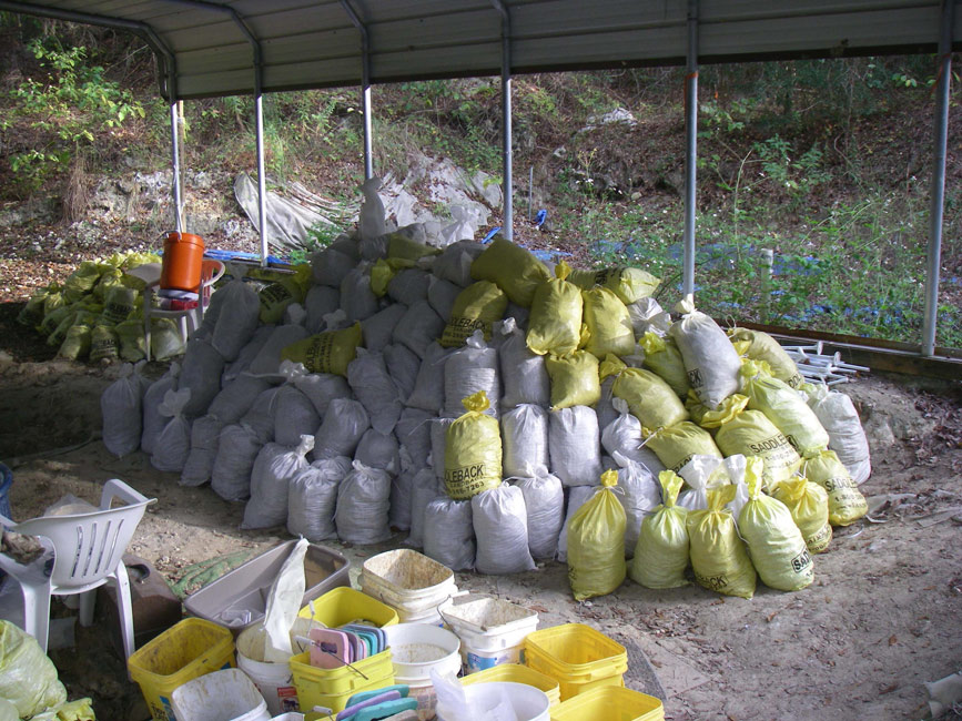 Filled bags of fossil-bearing sediment for screen-washing. By the end of the dig we had over three times these many bags filled | Photo © Richard Hulbert