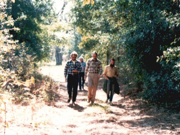 (left to right) Bruce MacFadden, Malcolm McKenna, and Will Downs walking, November 1980