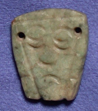 Pendant with a human face