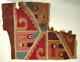 Textile fragment representing an abstract winged deity Peru, Southern Highlands or Coast, Middle Horizon (A.D. 500-900)