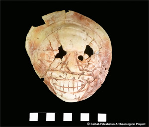 Skull-engraved Spondylus americanus shell. Photo courtesy of the Ceibal-Petexbatun Archaeological Project.