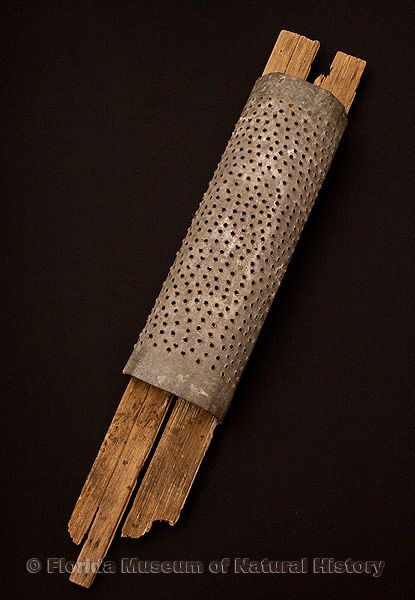 Coontie grater, Seminole, wood, perforated iron, glue, mid-20th century, west central Everglades, 44.0” long (93512).