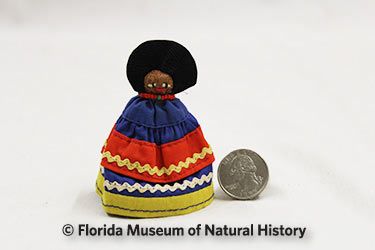 Figure 11: Small female pin doll, Seminole (E998b) Palmetto fiber, cotton cloth, metal. Circa 1960s, 7.8 cm. Donated by the Caprons.