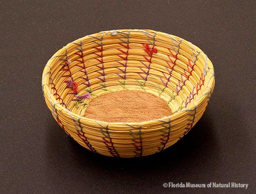 Basket, Seminole, sweetgrass, cotton thread, palmetto fiber, ca. 1930-1950, 5 x 11.5 cm. Donated by Solon T. Kimball (83-7-E853).