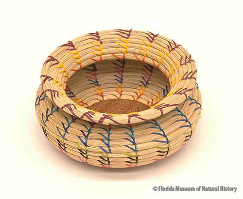Basket, Seminole, sweetgrass, cotton thread, palmetto fiber, 2005, 8 x 19 cm. Made by Donna Frank, purchased by Darcie MacMahon and William Marquardt with museum funds (2006-20-1).