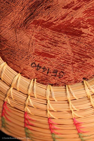 Basket, Seminole, sweetgrass, cotton thread, palmetto fiber, circa 20th c., 7.6 x 17.7 cm. Donated by Keith and Sara Reeves (2012-46-9).