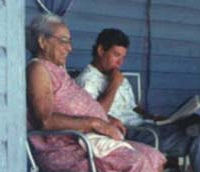 Oral historian Robert Edic interviews Esperanza Woodring on her porch, April 17, 1990 (Photo by Karen Walker.)