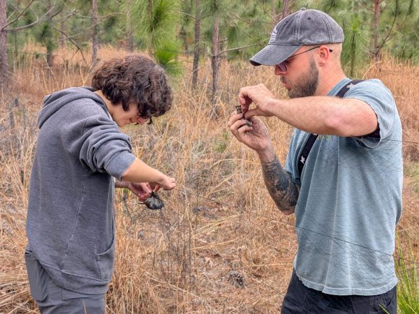 Students learn how to extract birds from mistnets