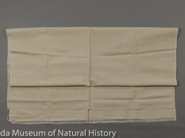 Joot (=jooth =jhut) fabric of tropical silk (Antheraea paphia = A. mylitta), handwoven in West Bengal. Joot is brushed from the outer layers of cocoons before they are reeled, and the that outer silk is spun into joot yarn. This type of fabric has not been produced in India for several years. Joot, which can also be spun from the outer layers of mulberry silk cocoons, is also spelled jute, not to be confused with the plant fiber jute. Measures 90 cm X 90 cm