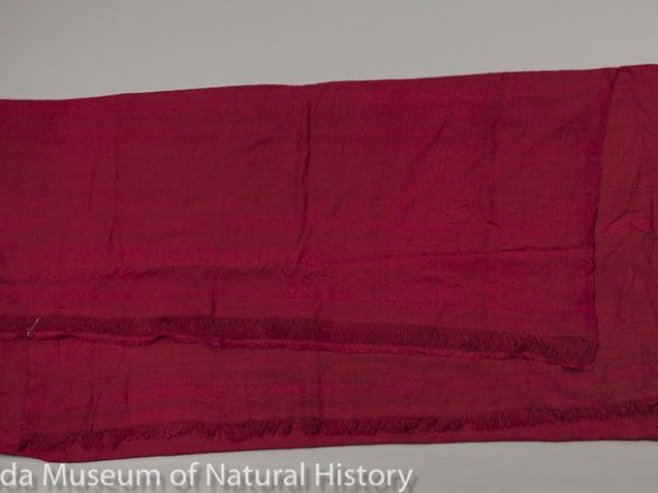 Tibetan monk’s sen (wrapper) composed of 100% eri silk (Samia ricini), handwoven and dyed maroon in Nepal. Maroon, red, and purple are colors of the clergy in Tibet and Bhutan. Measures 116 cm X 234 cm