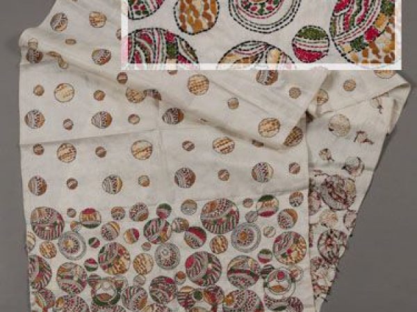 Woman’s wrapper composed of reeled tropical tasar silk in Shantiniketan, West Bengal in 2010. The piece was designed by a man named Asit Kumar Mondal, but handwoven and embroidered by women. The tasar silk is bleached, and the piece was embroidered by hand in the kantha technique with colored acrylic thread. Measures 51 cm x 205 cm