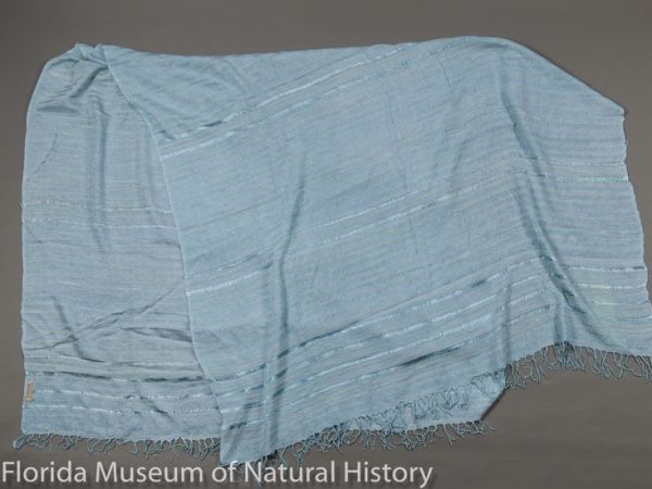 Throw composed of eri silk (Samia ricini), handspun on drop spindles and handwoven in Ethiopia, using traditional Ethiopian weaving techniques. The blue color is indigo (Indigofera sp.) a natural dye. Eri silk culture was introduced from Japan to Ethiopia in 2001.