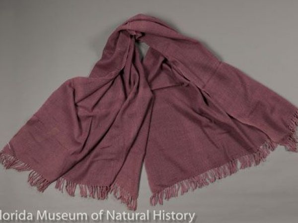 Woman’s shawl composed of tasar silk (Antherea sp) and merino wool, made in Himachal Pradesh by a retired engineer named Kamal as an experimental piece, combining wild silk and high quality wool. The color is from lac dye (Kerria lacca). The yarns were handspun and the piece was hand-loomed. Measures 92 cm x 150 cm.