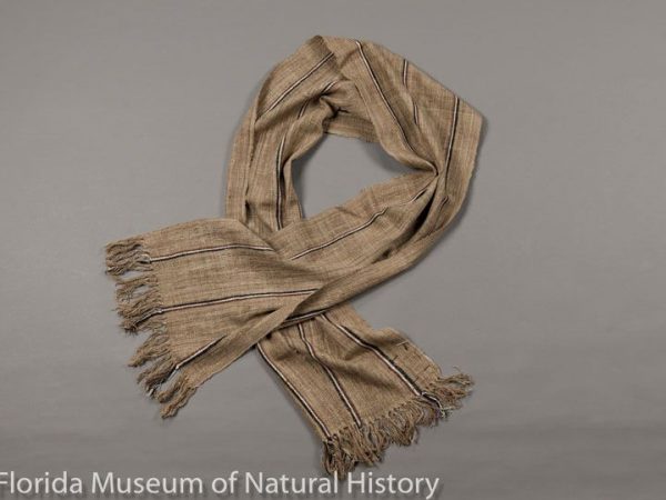 WIld silk scarf from Madagascar. Handspun yarn and handwoven by women in village of Soatanana, in highland region of Ambositra. Silk from cocoons of Borocera (Lasiocampidae) on tapia trees, and natural dyes.