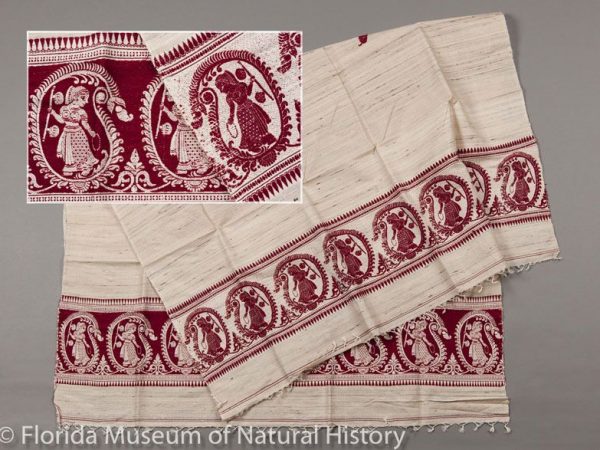 Woman’s shawl of tropical tasar silk (Antheraea paphia=A. mylitta) of kethe (=katia) yarn that was handspun in Murshidabad, India. The natural colored yarns were handwoven in Bakreswar, Birbhum District, West Bengal. Jacquard brocade Baluchari panels. This piece was made in 1999. Measures 90 cm X 200 cm