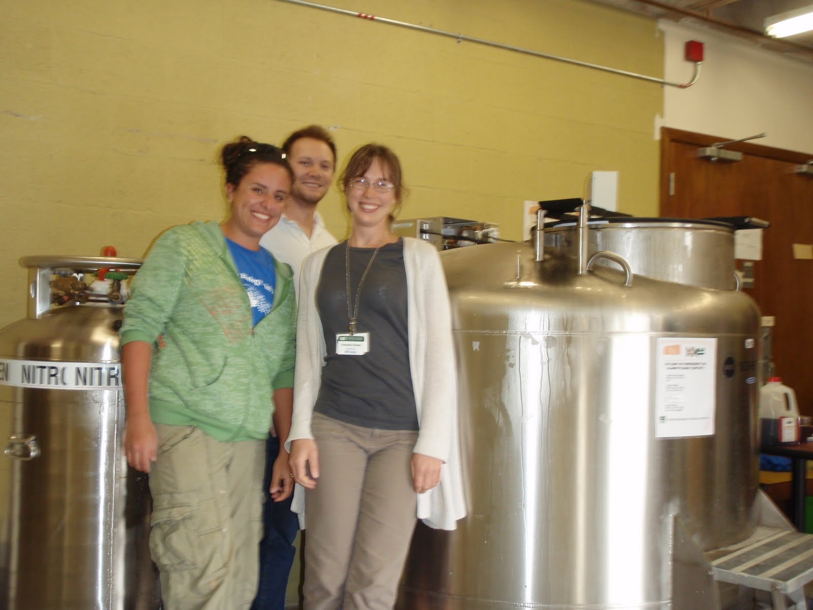 Chelsey, Derek, and Mandy with the cryofreezer